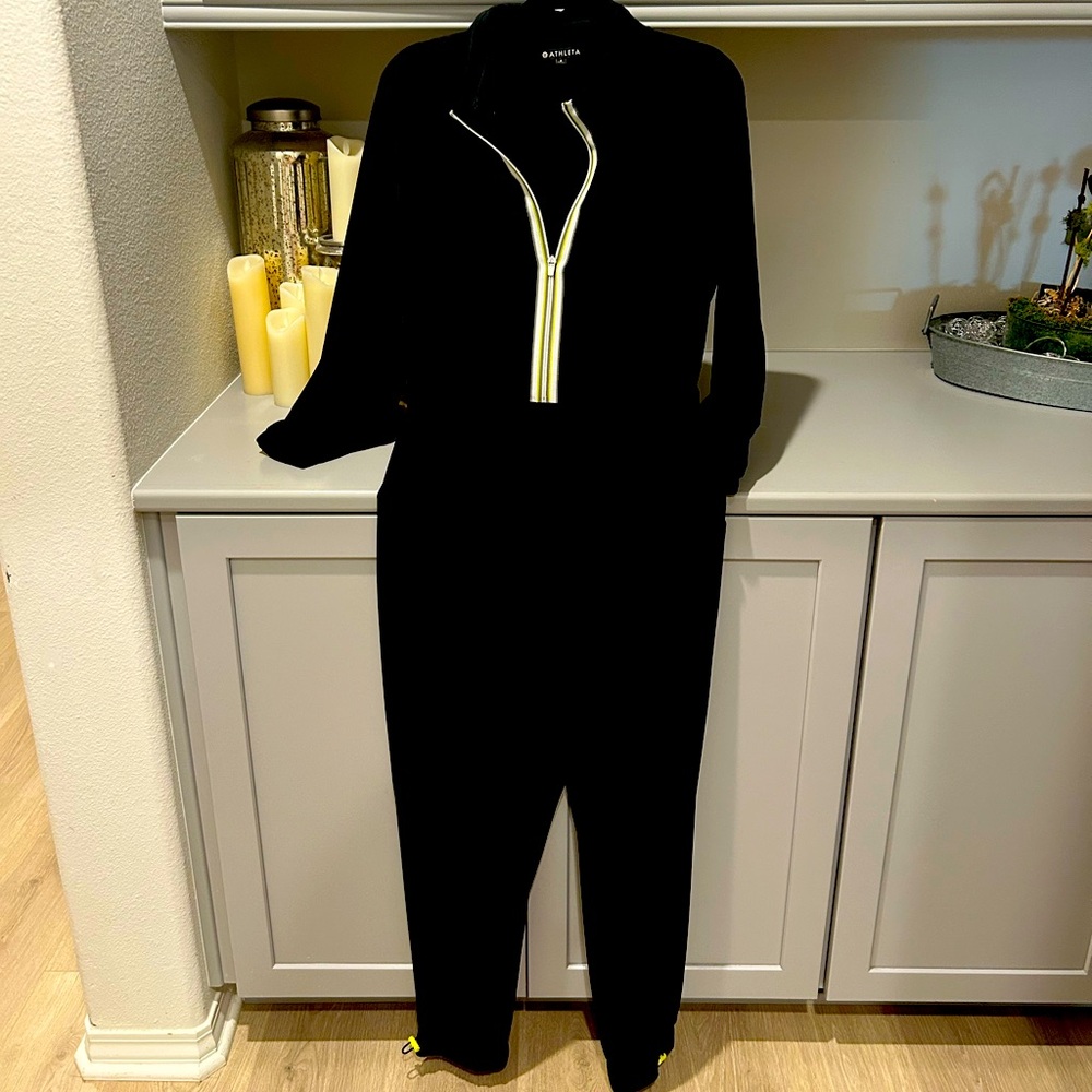 Athleta. jumpsuit w/hidden hood& contrasting ribbon detailing on front zipper